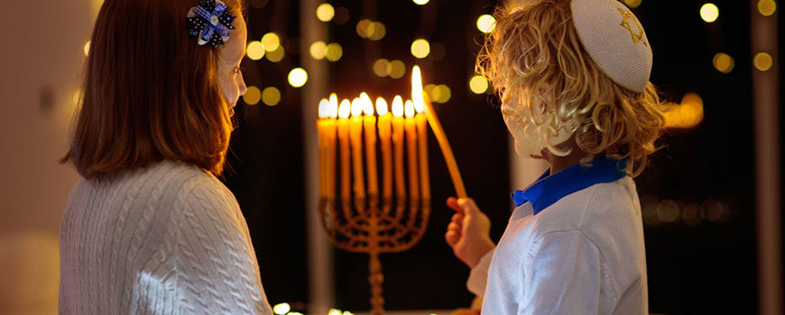Children lighting the menorah